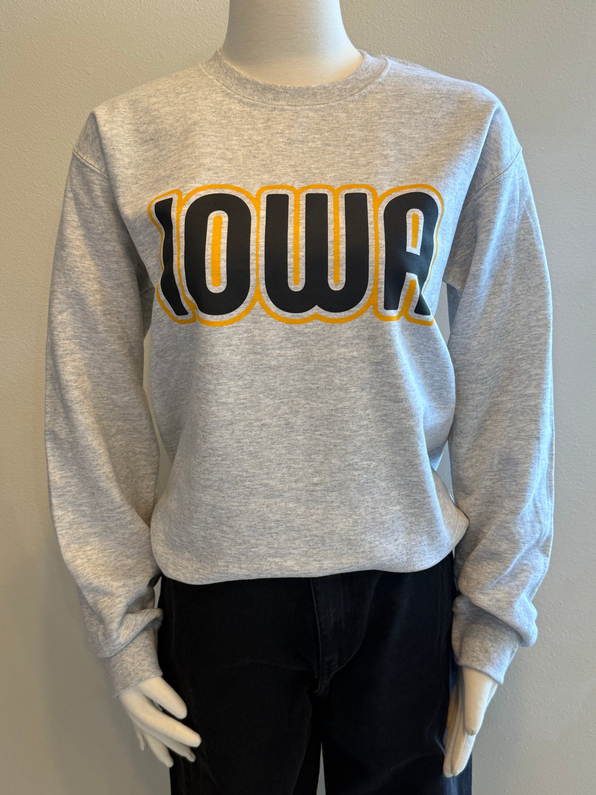 Gray sweatshirt with 'Iowa' printed on it,.